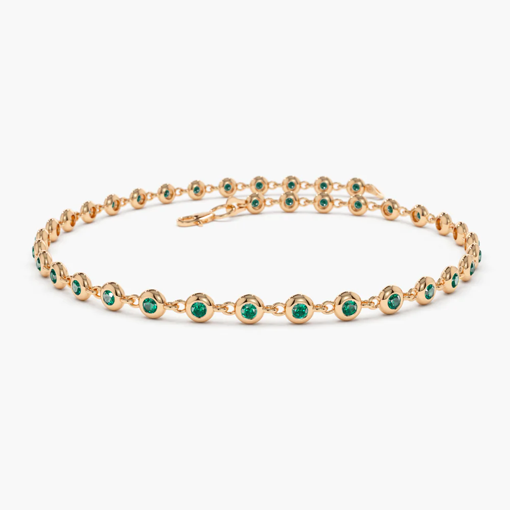 400548_80183b3f38724d7ab318d988486df6ddmv2.webp 18k Solid Gold Bezel Set Emerald Tennis Bracelet - Image 1